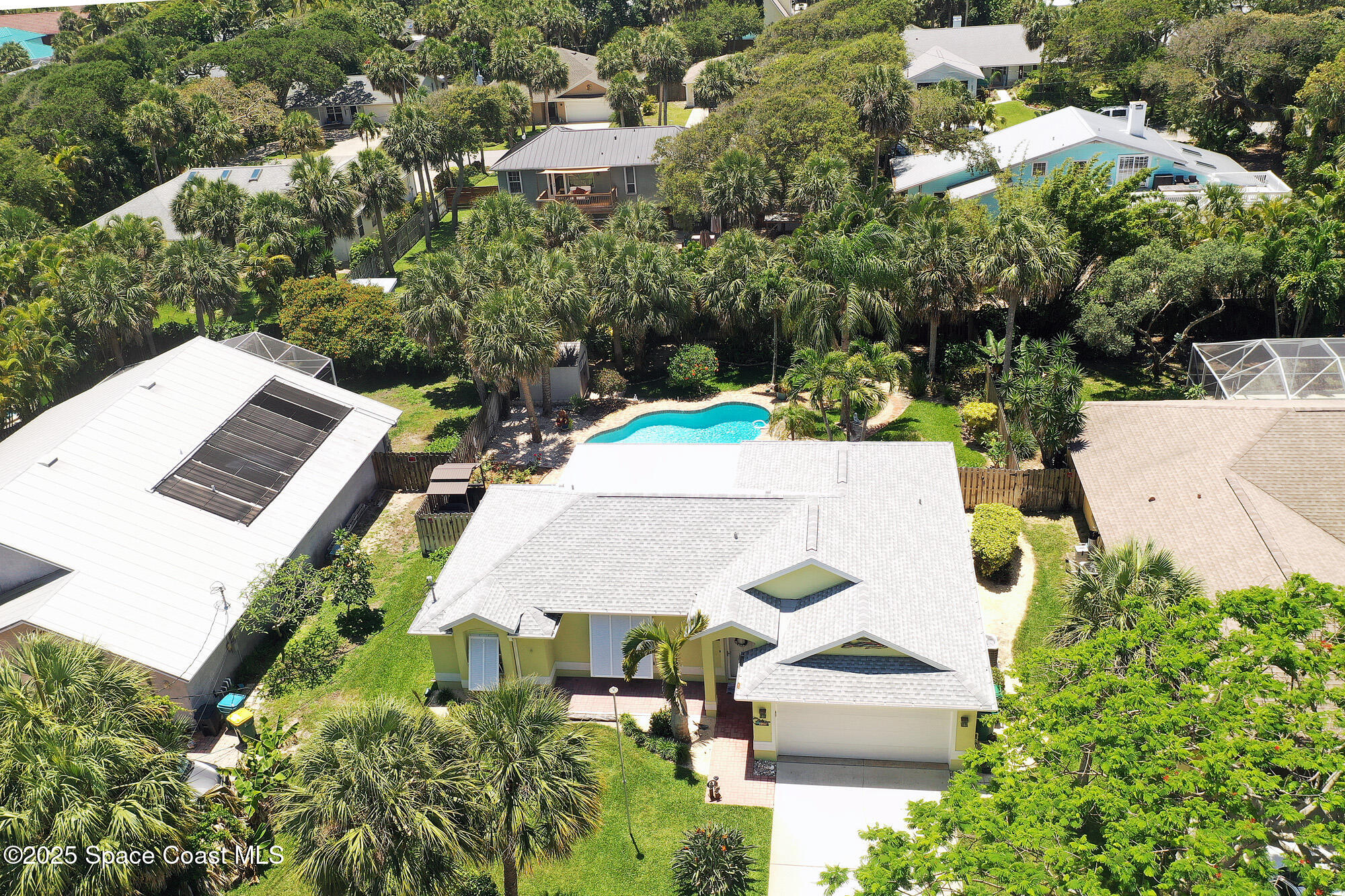 103 Matanzas Road Melbourne Beach, FL 32951 - Photo 32 of 37 an aerial view of a house with yard and parking
