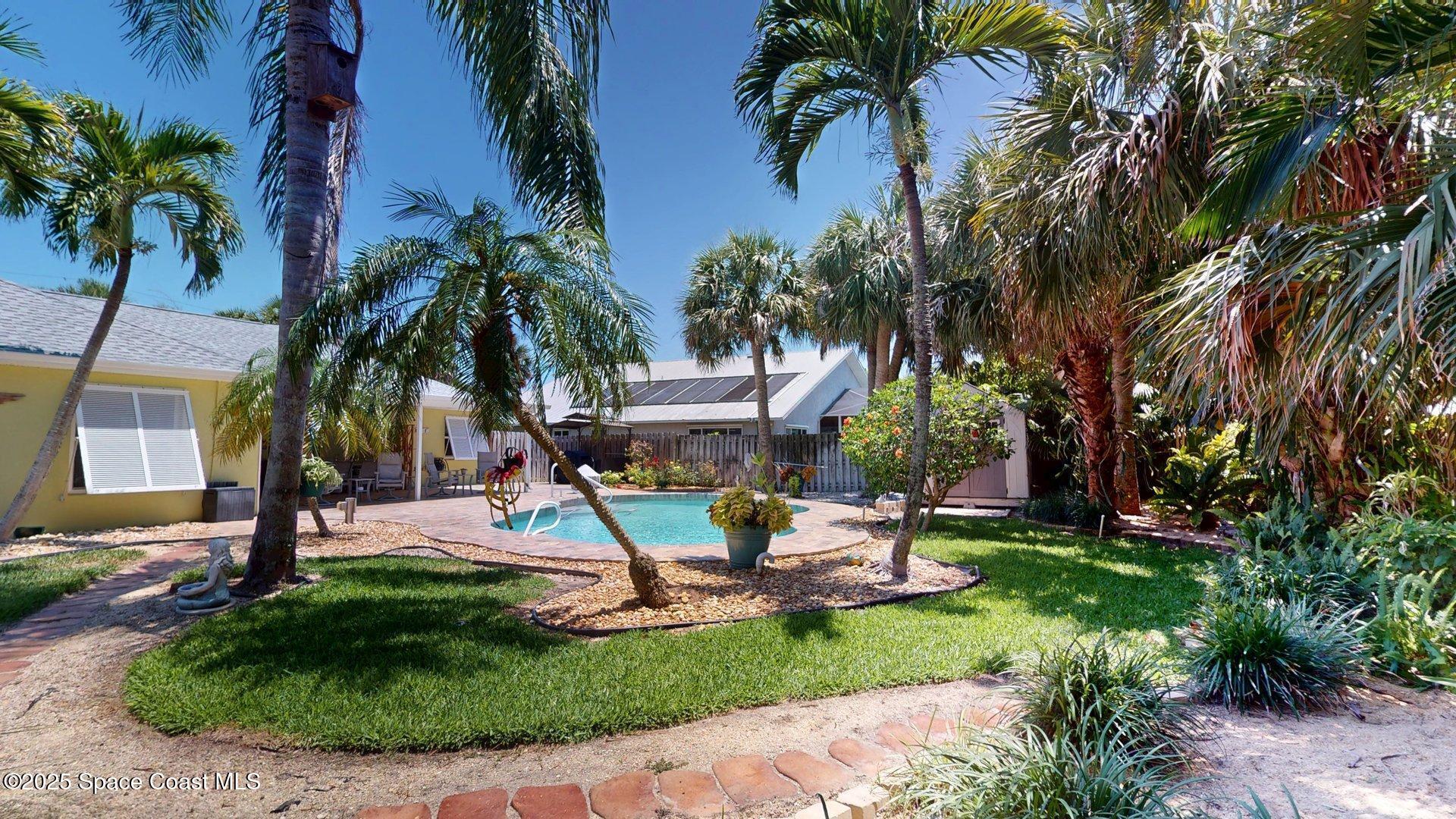 103 Matanzas Road Melbourne Beach, FL 32951 - Photo 5 of 37 a view of a backyard with a patio