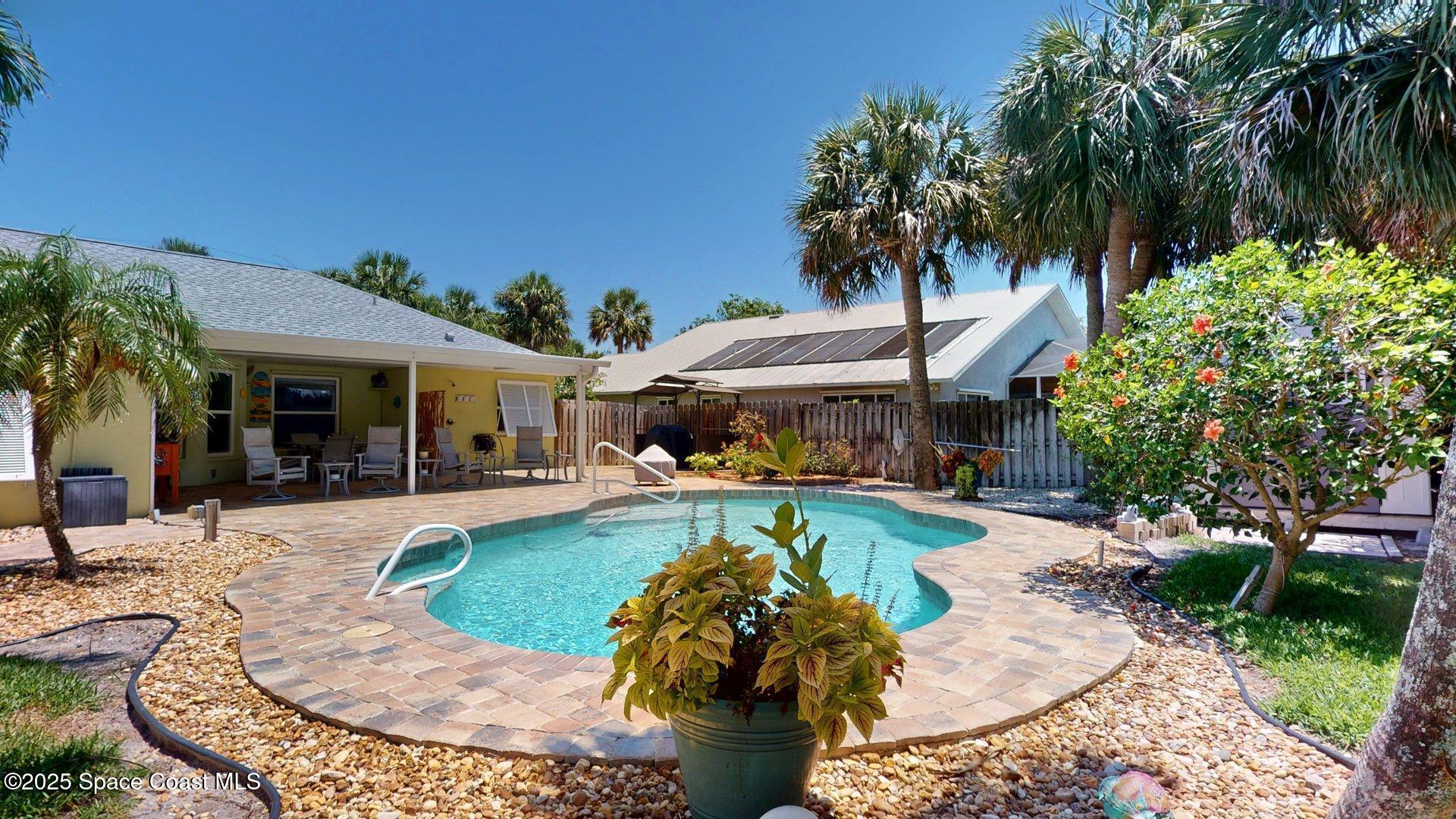 103 Matanzas Road Melbourne Beach, FL 32951 - Photo 6 of 37 a view of a house with swimming pool and sitting area
