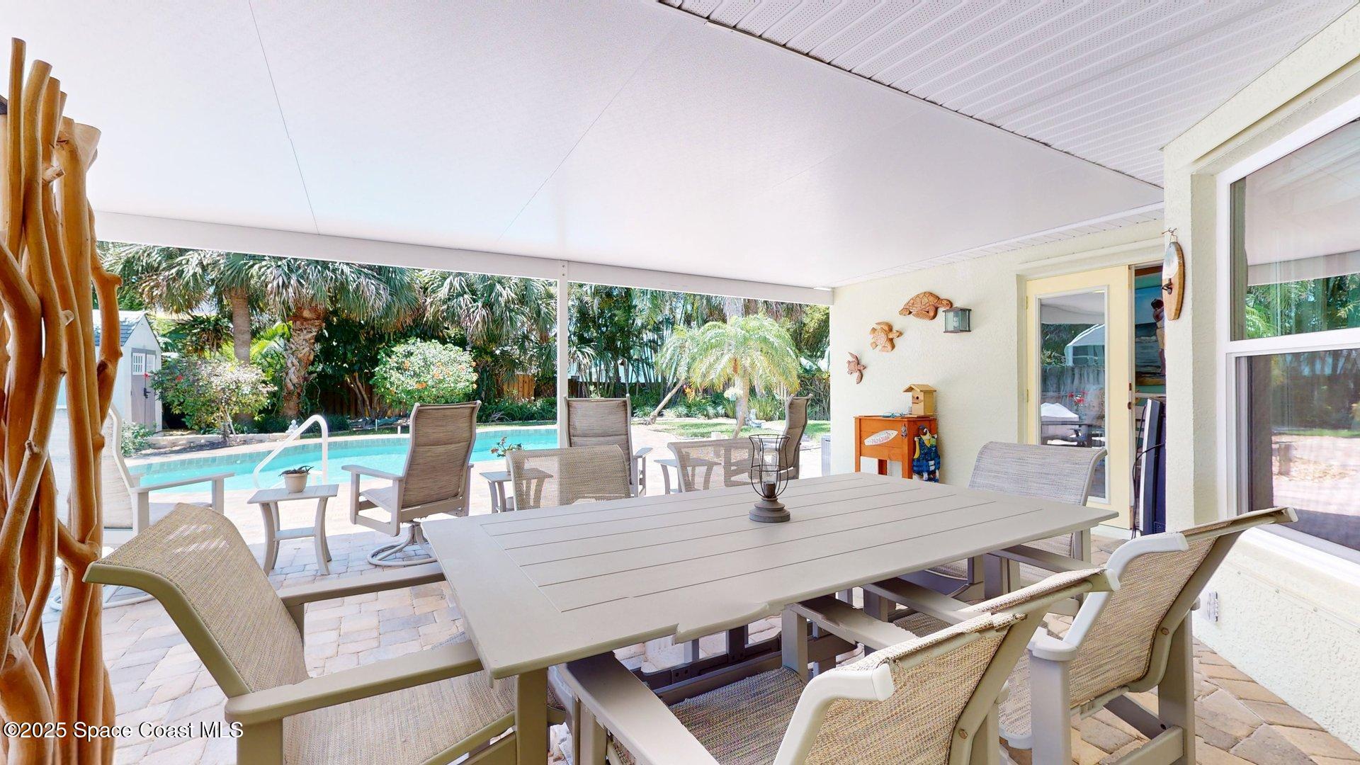 103 Matanzas Road Melbourne Beach, FL 32951 - Photo 9 of 37 a view of a dining room with furniture window and outside view