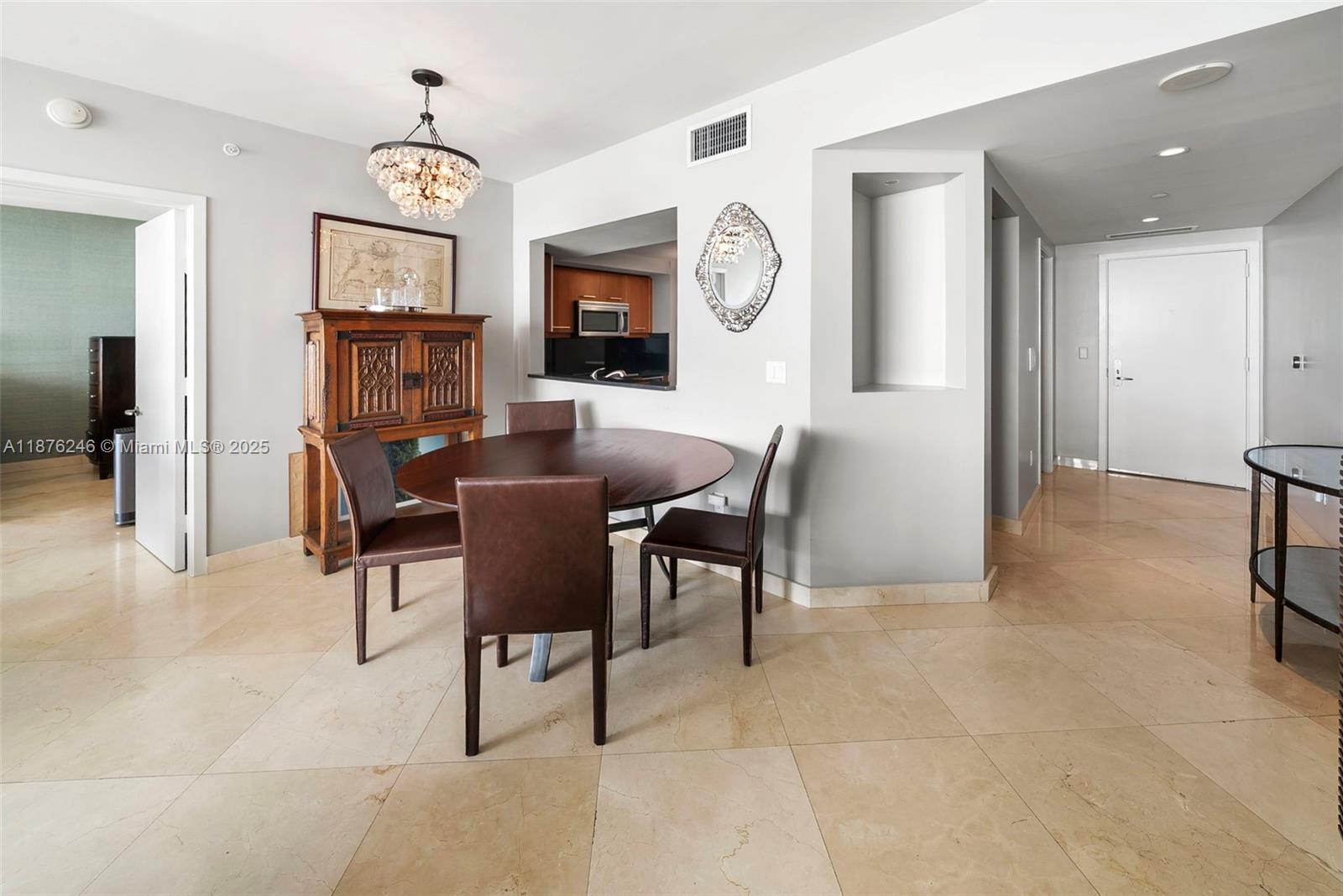 1331 Brickell Bay Drive, Unit 1105 Miami, FL 33131 - Photo 12 of 17 a view of a livingroom with furniture and a window