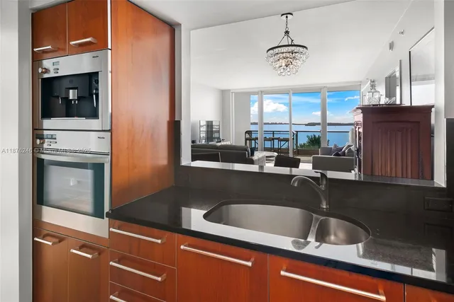 a kitchen with a sink cabinets and window