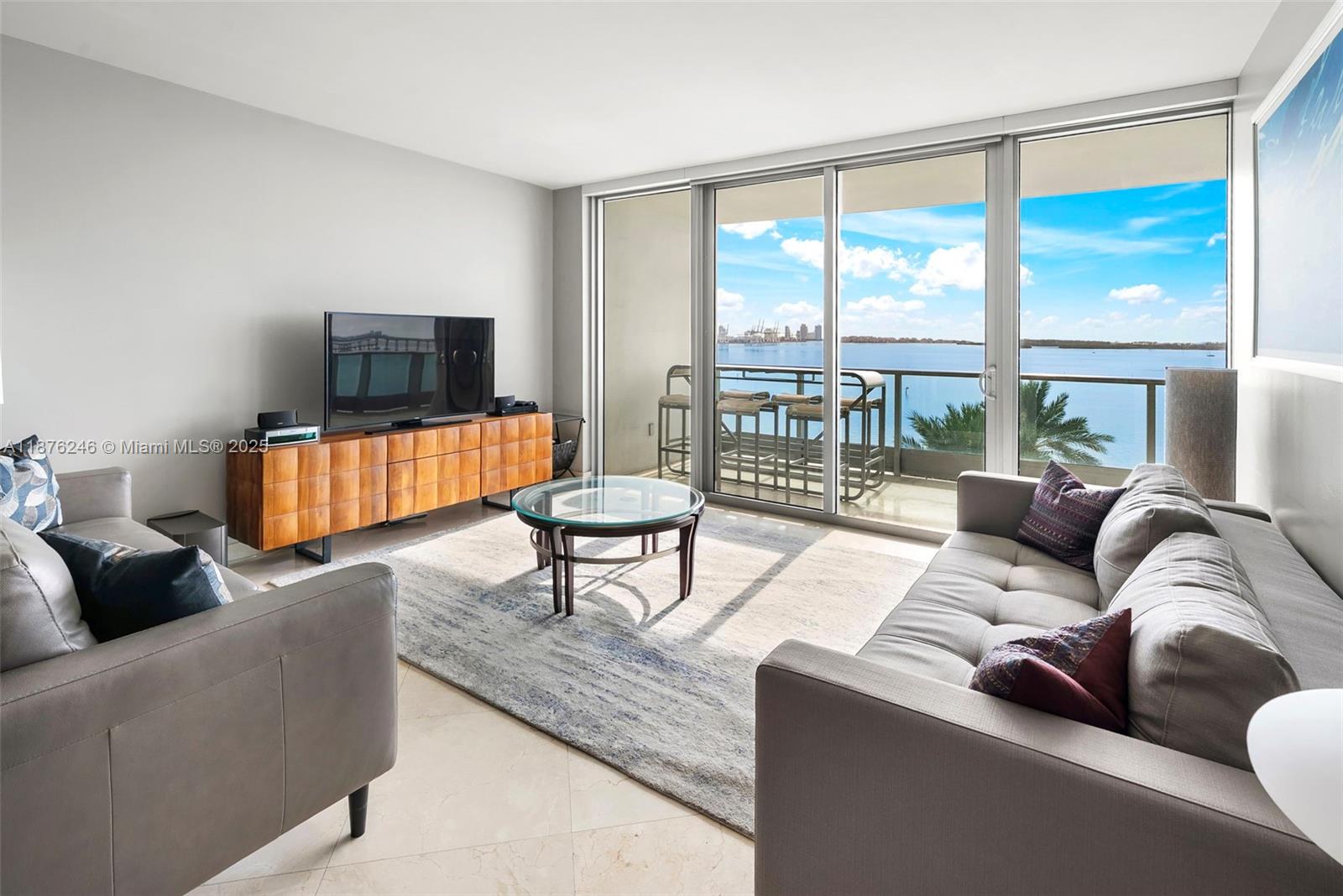 1331 Brickell Bay Drive, Unit 1105 Miami, FL 33131 - Photo 2 of 17 a living room with furniture and a large window