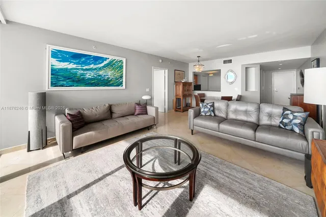 a living room with furniture a rug and a large window