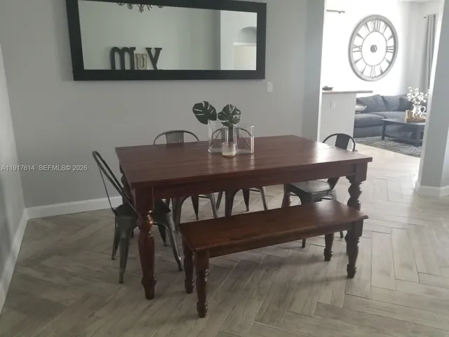 a kitchen with stainless steel appliances granite countertop a refrigerator stove a sink and a microwave