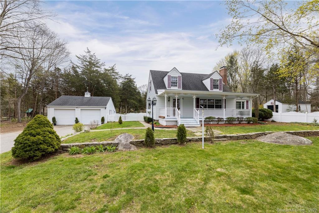 1702 Center Groton Road Ledyard, CT 06339 - Photo 1 of 1 a front view of house with yard and trees in the background