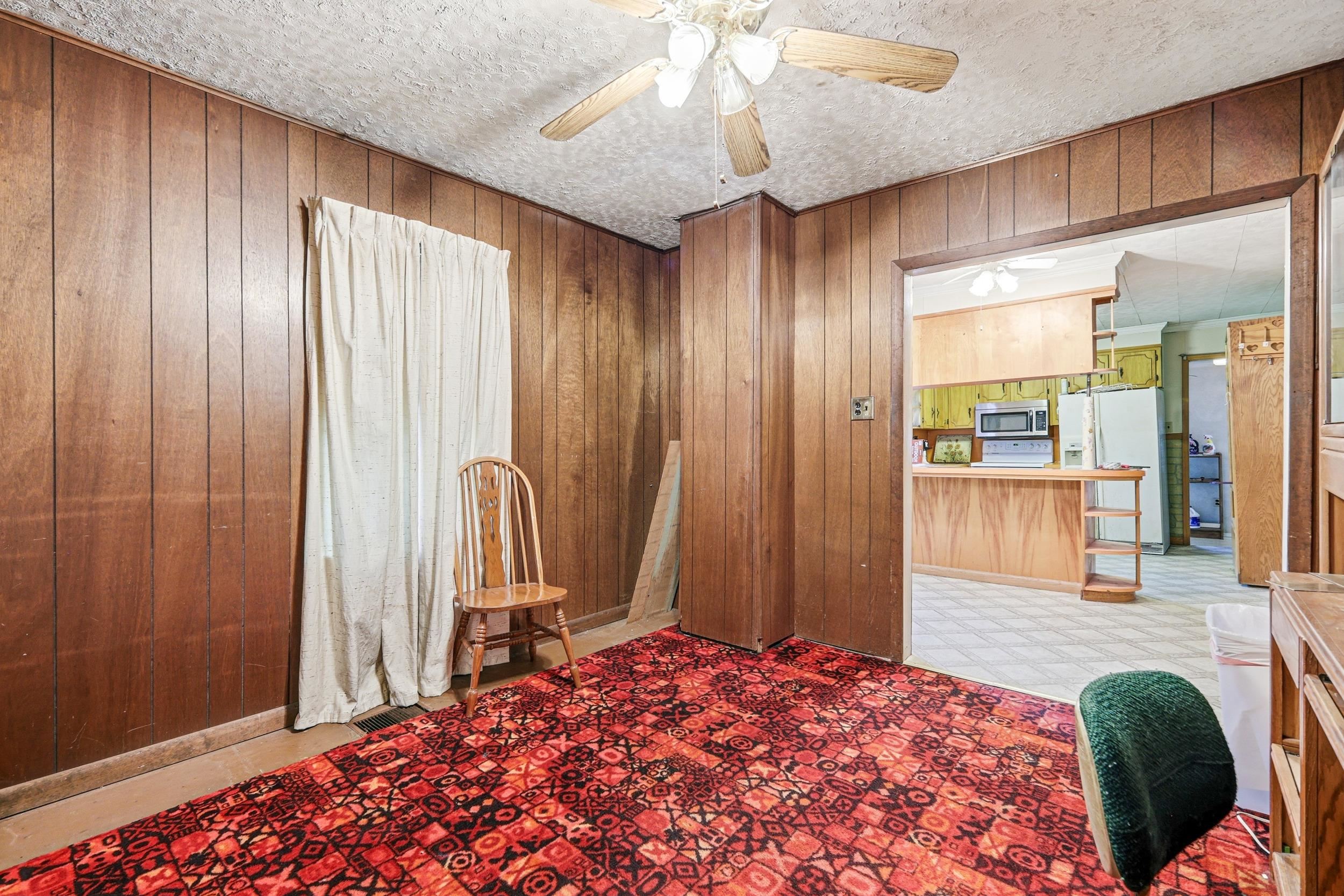 13896 Rockingham Pike Elkton, VA 22827 - Photo 34 of 60 a bedroom with a bed and a mirror