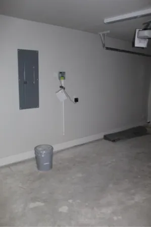 a white toilet and tub sitting next to a bathroom sink