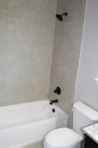 a view of backyard with wooden fence and trees