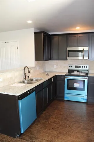 a kitchen with a stove and a sink