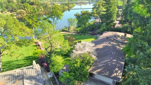 a view of yard with swimming pool and green space