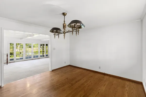 a bathroom with a granite countertop sink a shower and a mirror