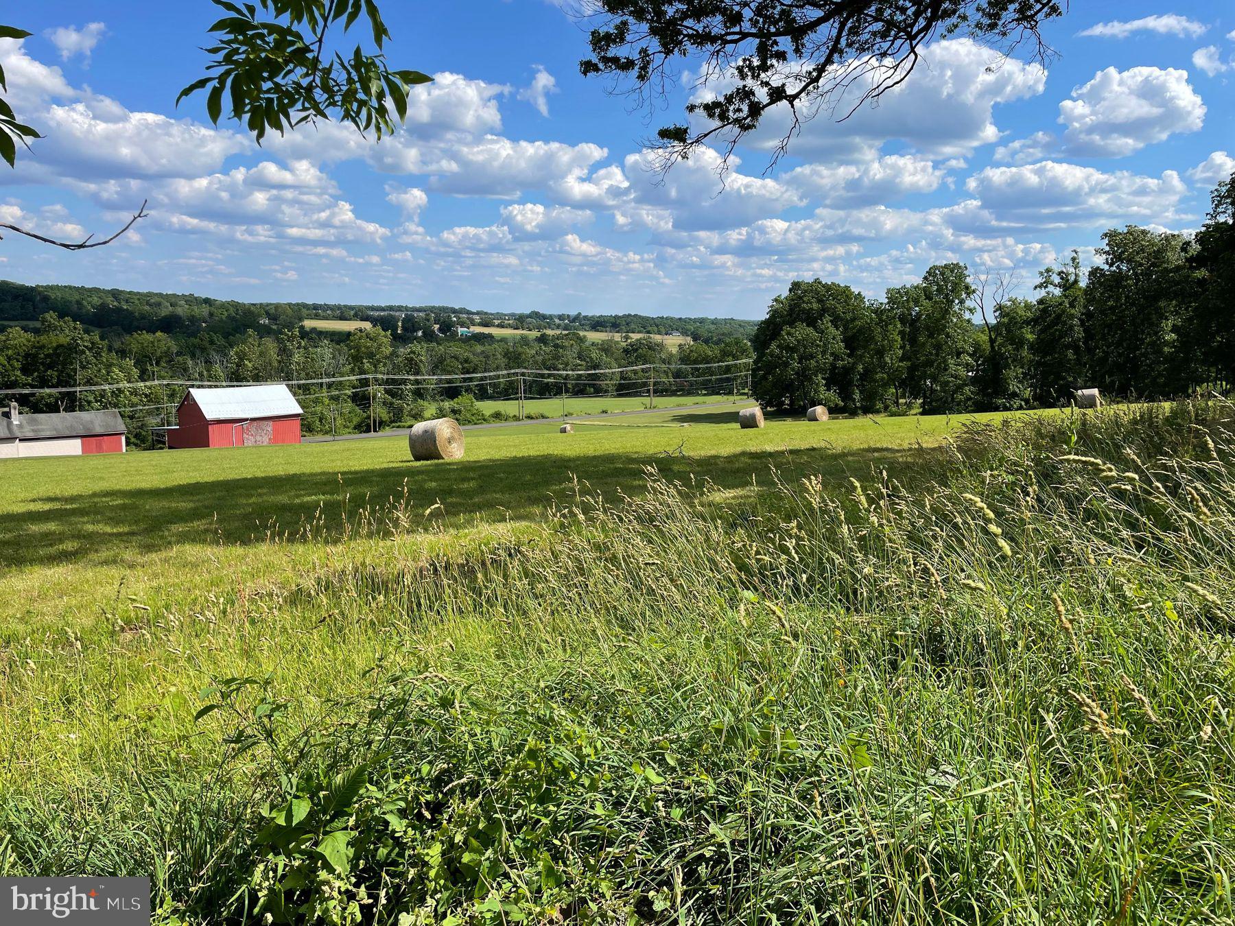 Lot 1 Curly Hill Road Doylestown, PA 18902 - Photo 26 of 40 a view of a lake with a building in the background
