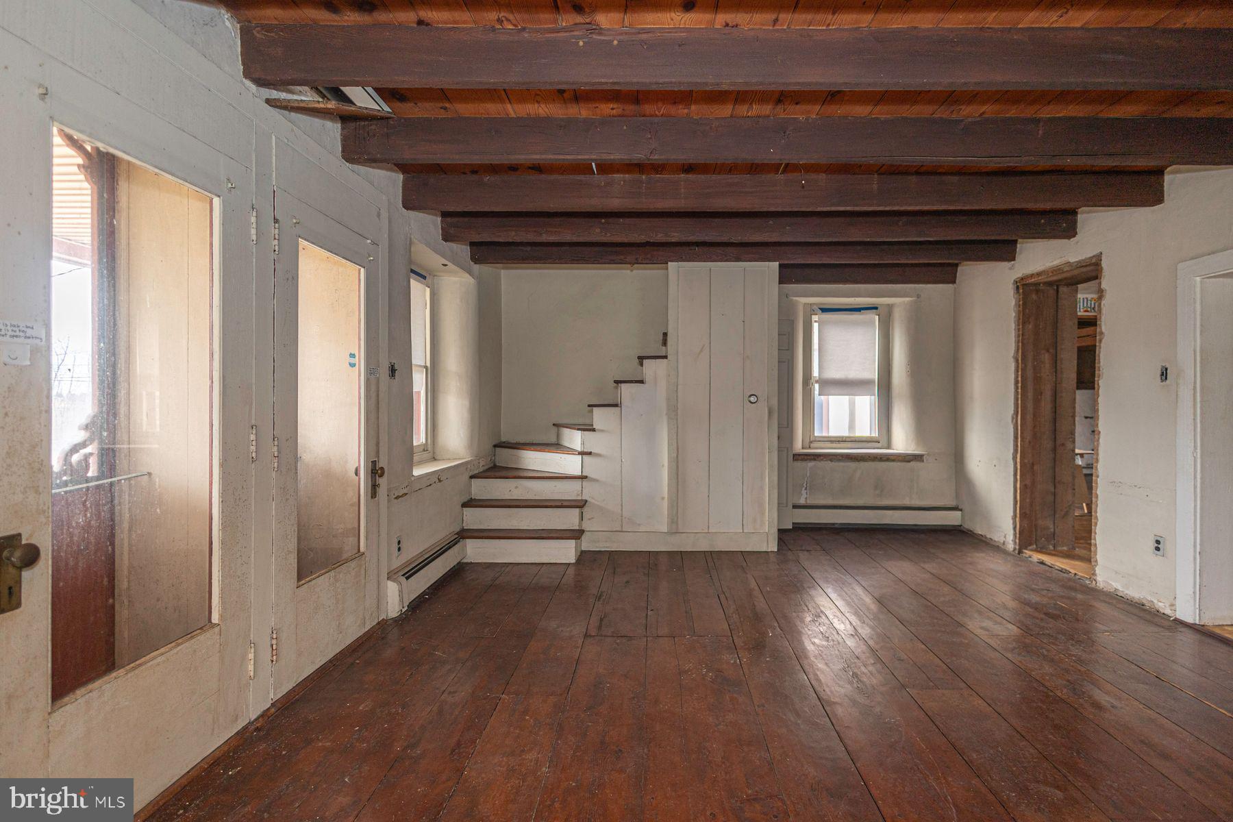 Lot 1 Curly Hill Road Doylestown, PA 18902 - Photo 32 of 40 a view of a hallway with wooden floor and staircase