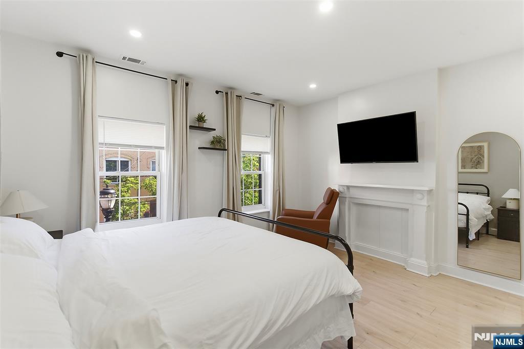 22 8th Avenue Newark, NJ 07104 - Photo 16 of 26 a bedroom with a bed window and a television