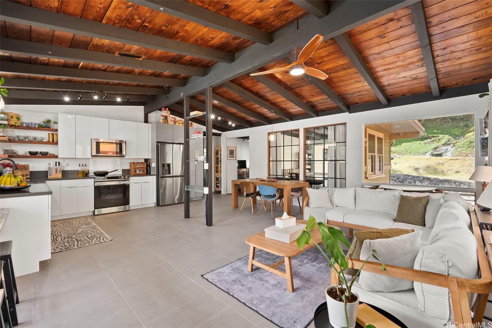 256 Puiwa Road Honolulu, HI 96817 - Photo 1 of 1 a living room with lots of furniture and kitchen view