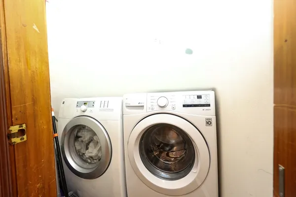a utility room with dryer and washer