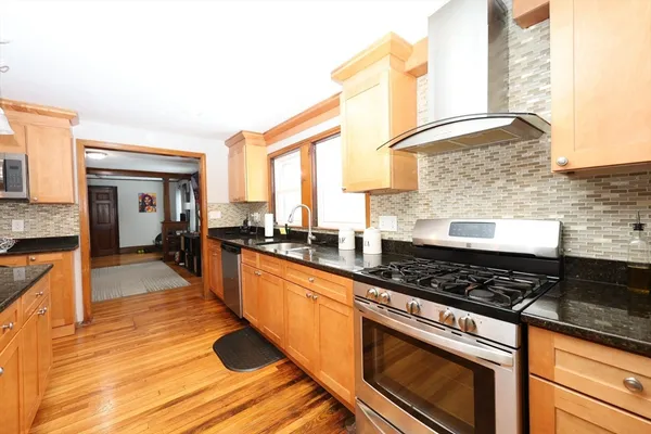 a kitchen with counter top space and stainless steel appliances