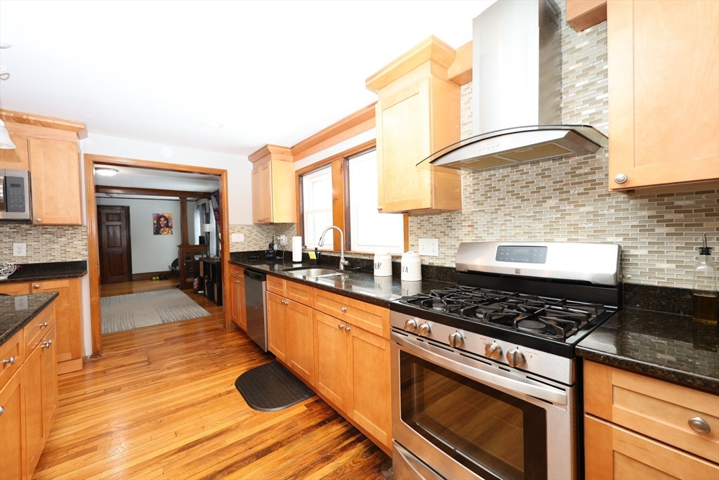 65 Clifford Street, Unit 2 Boston, MA 02136 - Photo 17 of 27 a kitchen with counter top space and stainless steel appliances