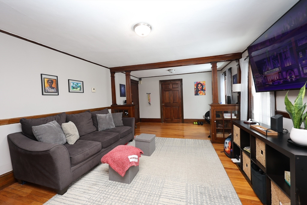 65 Clifford Street, Unit 2 Boston, MA 02136 - Photo 21 of 27 a living room with furniture and a rug