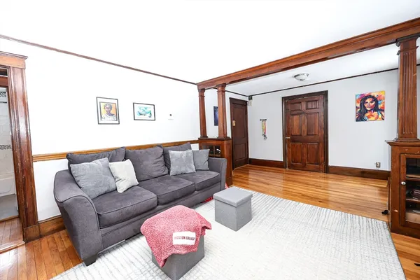 a view of a livingroom with furniture and wooden floor