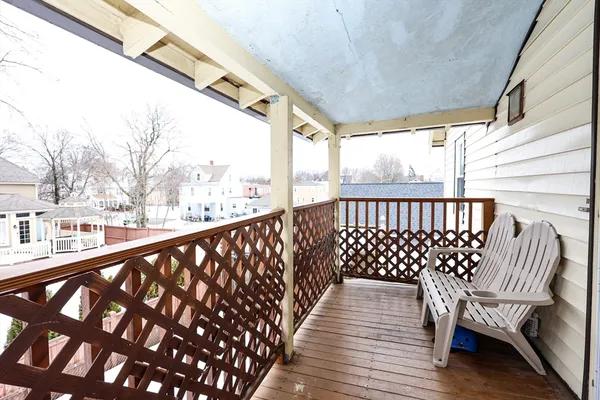 a view of balcony with wooden floor