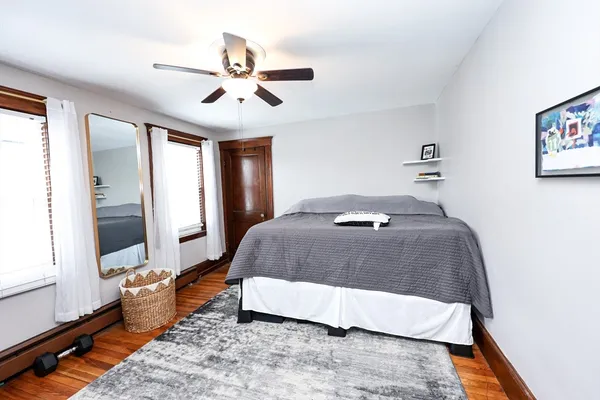 a bedroom with a bed and window