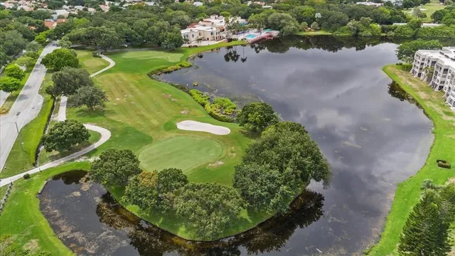 a view of a lake with a yard