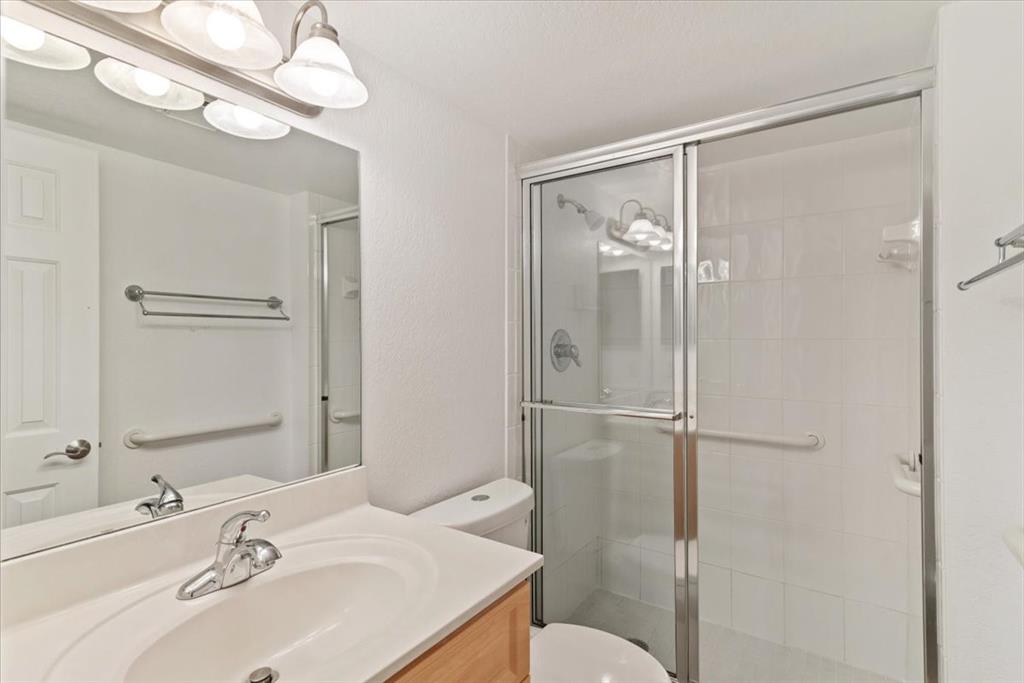 9470 Poinciana Place, Unit 1#103 Davie, FL 33324 - Photo 8 of 32 a bathroom with a sink toilet and shower