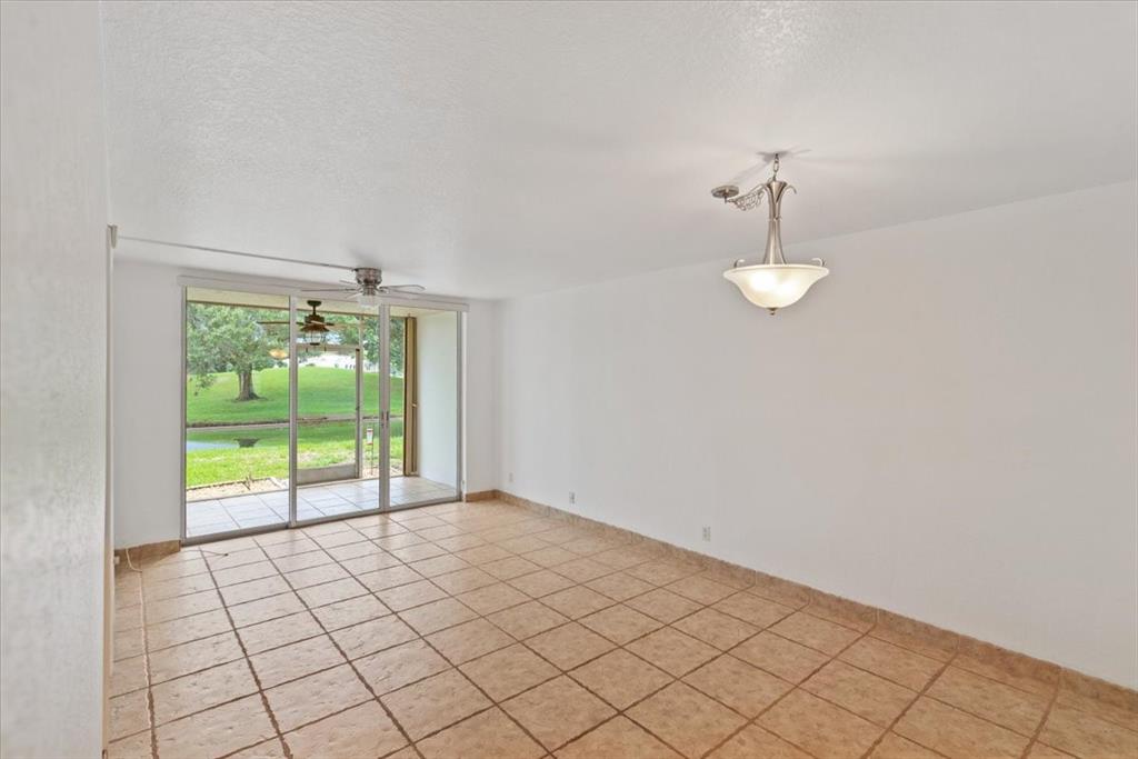 9470 Poinciana Place, Unit 1#103 Davie, FL 33324 - Photo 9 of 32 a view of an empty room with a window