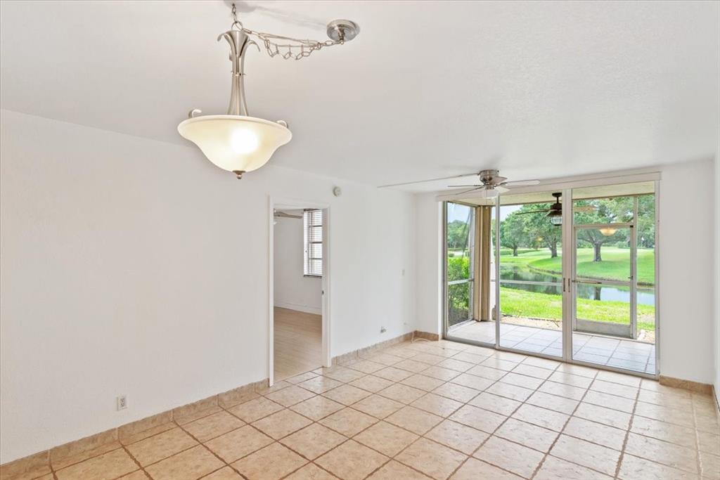 9470 Poinciana Place, Unit 1#103 Davie, FL 33324 - Photo 10 of 32 a view of an empty room with a window
