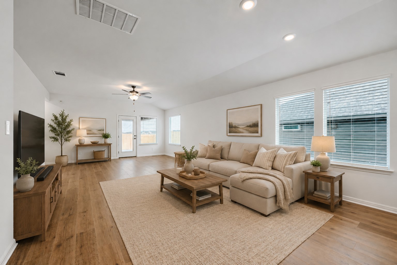 146 Diablo Rim Terrace Dripping Springs, TX 78620 - Photo 2 of 32 Natural light floods this inviting living area and a contemporary ceiling fan.