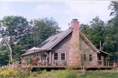 1417 Monterey Road Otis, MA 01253 - Photo 1 of 2 a view of a house with a yard