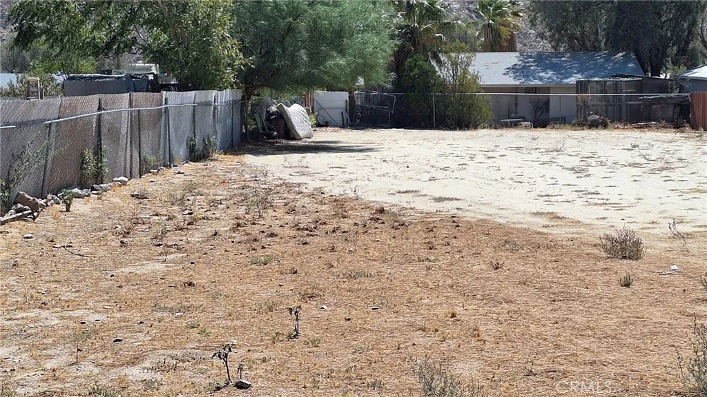 0 Irene Cabazon, CA 92230 - Photo 8 of 12 a wooden bench sitting in the middle of a yard