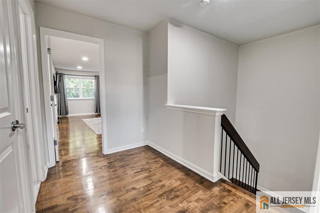 3003 Hana Road Edison, NJ 08817 - Photo 22 of 45 a view of hallway with wooden floor