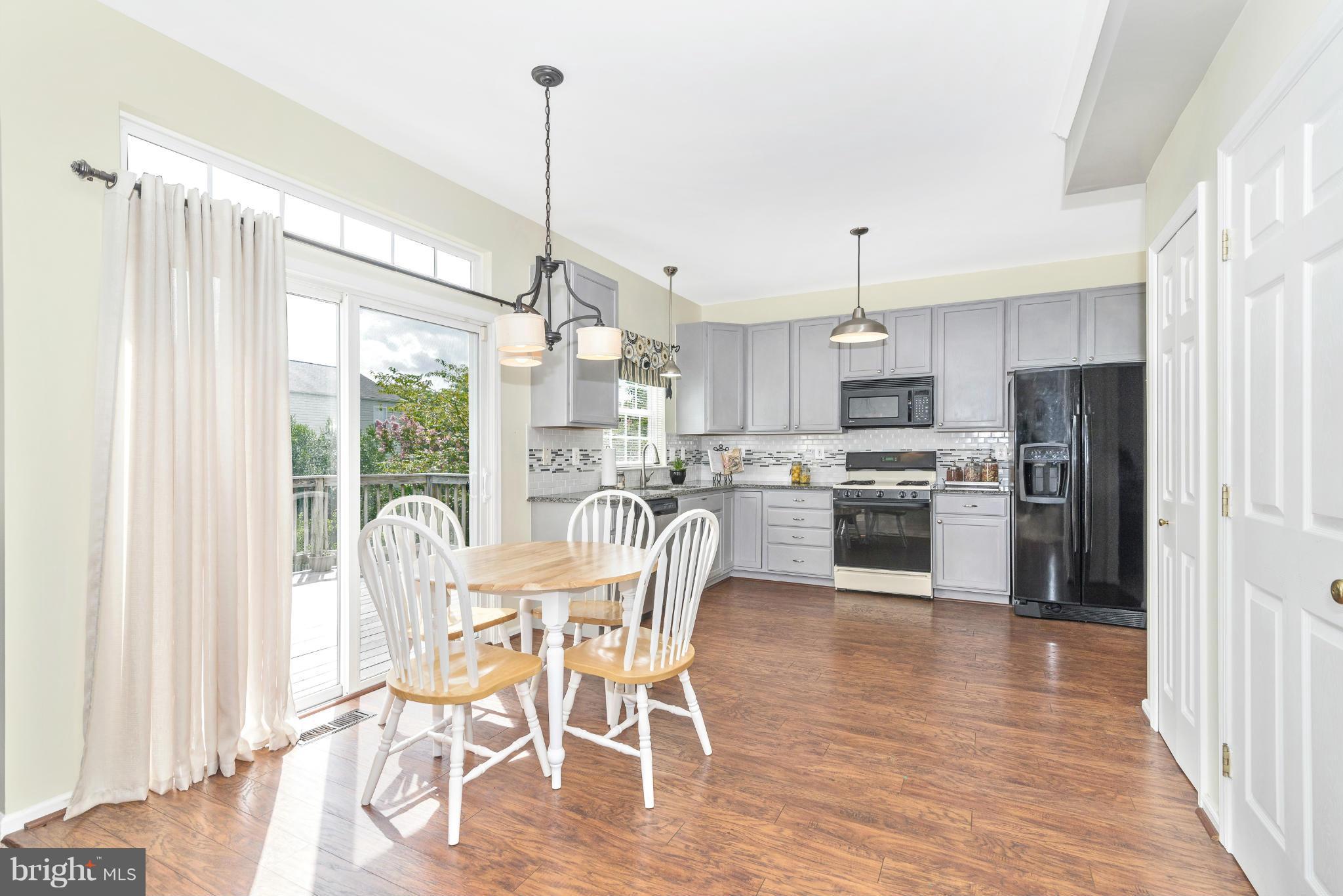 1208 Crossbow Road Mount Airy, MD 21771 - Photo 5 of 30 Kitchen with Sliding Glass Door to Deck