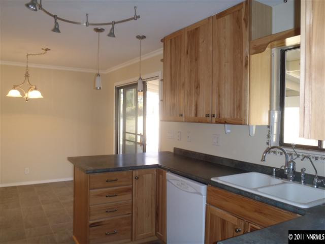 1305 Hot Springs Road Reno, NV 89521 - Photo 4 of 13 a kitchen with a sink cabinets and window
