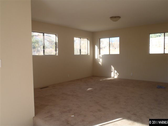 1305 Hot Springs Road Reno, NV 89521 - Photo 10 of 13 an empty room with windows