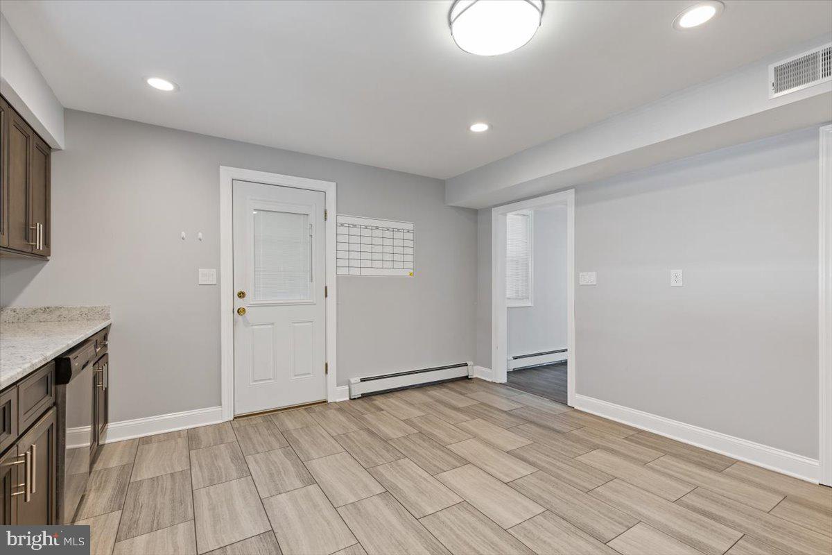 2921 Cowpath Road Hatfield, PA 19440 - Photo 11 of 30 a view of an empty room with wooden floor and a window