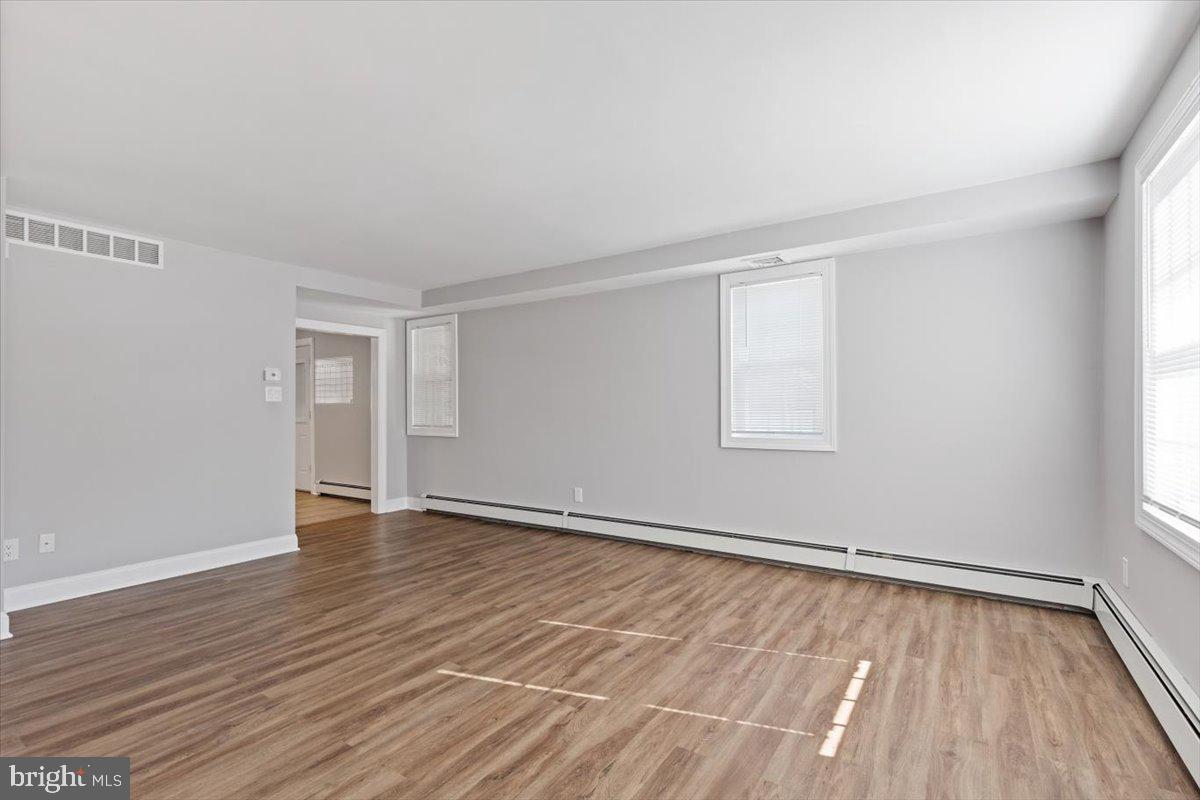 2921 Cowpath Road Hatfield, PA 19440 - Photo 14 of 30 a view of an empty room with wooden floor and a window