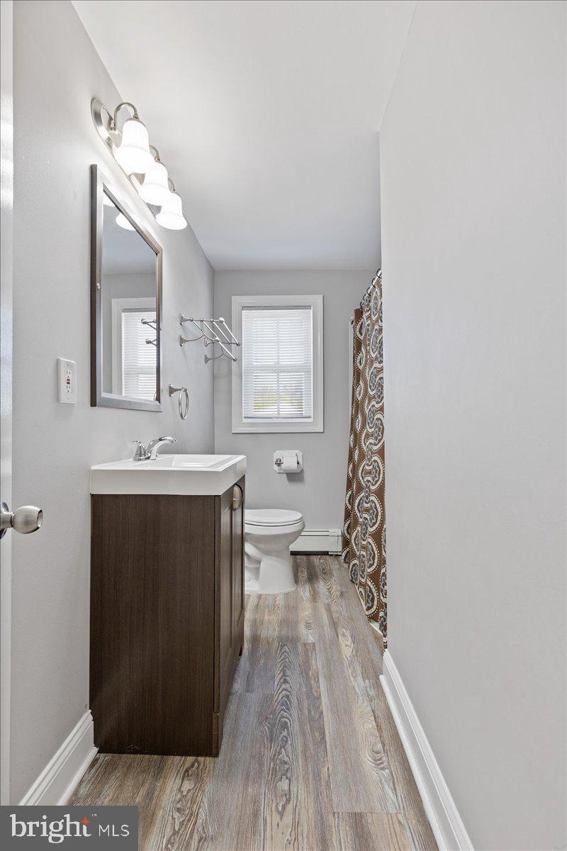 2921 Cowpath Road Hatfield, PA 19440 - Photo 16 of 30 a spacious bathroom with a sink mirror and a toilet
