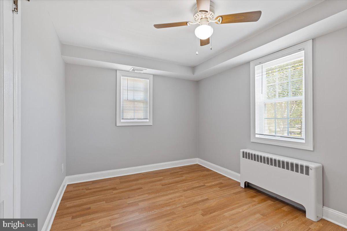2921 Cowpath Road Hatfield, PA 19440 - Photo 18 of 30 a view of an empty room with wooden floor and a window