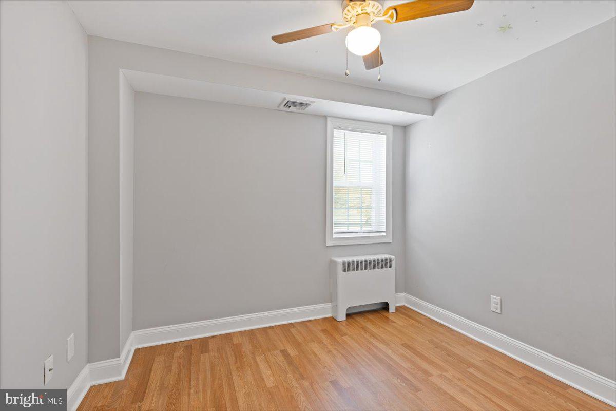 2921 Cowpath Road Hatfield, PA 19440 - Photo 20 of 30 an empty room with a window and wooden floor