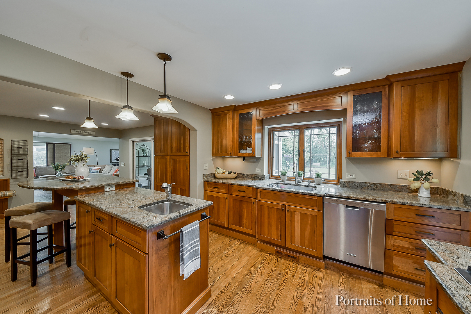 1122 Dunstan Road Geneva, IL 60134 - Photo 3 of 37 a kitchen that has a lot of cabinets in it and wooden floors