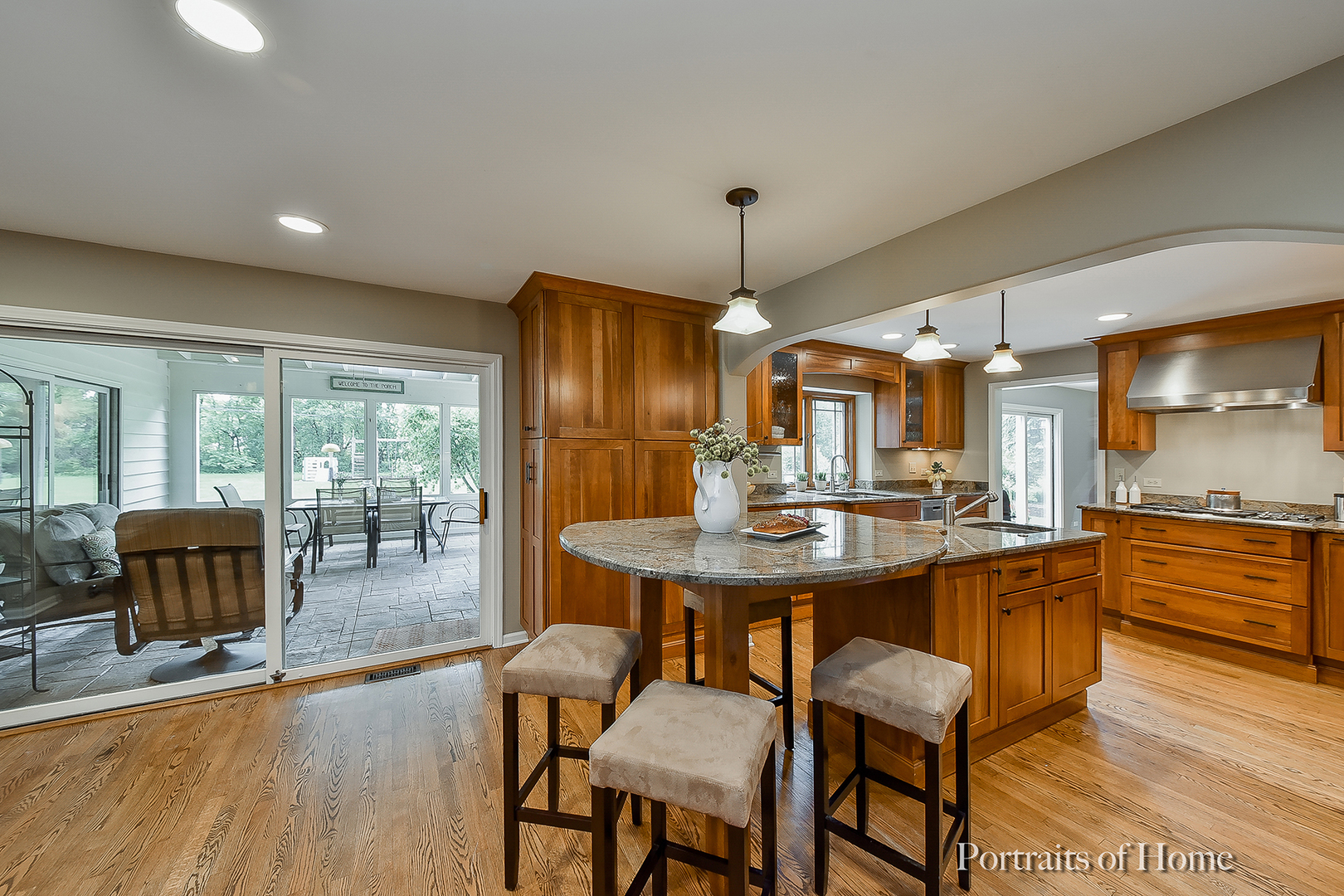 1122 Dunstan Road Geneva, IL 60134 - Photo 5 of 37 a kitchen with stainless steel appliances a dining table chairs and wooden floor