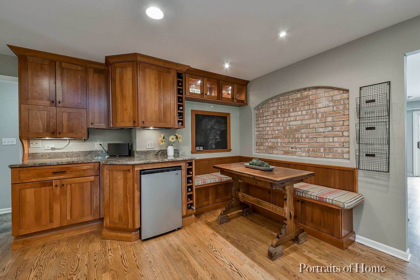 1122 Dunstan Road Geneva, IL 60134 - Photo 7 of 37 a kitchen with granite countertop a stove a sink and a wooden cabinets