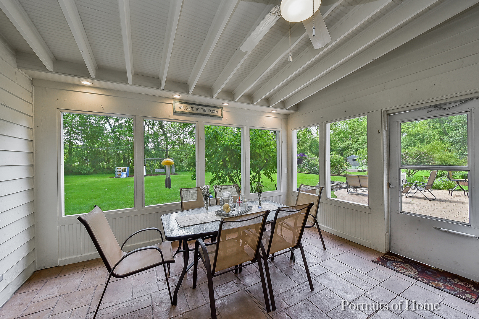 1122 Dunstan Road Geneva, IL 60134 - Photo 9 of 37 a view of a patio with a table chairs and a backyard