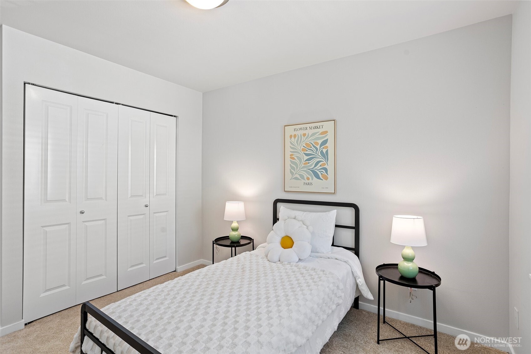 83 Sky Ridge Road Northwest Issaquah, WA 98027 - Photo 21 of 28 a bedroom with a bed and a lamp on table