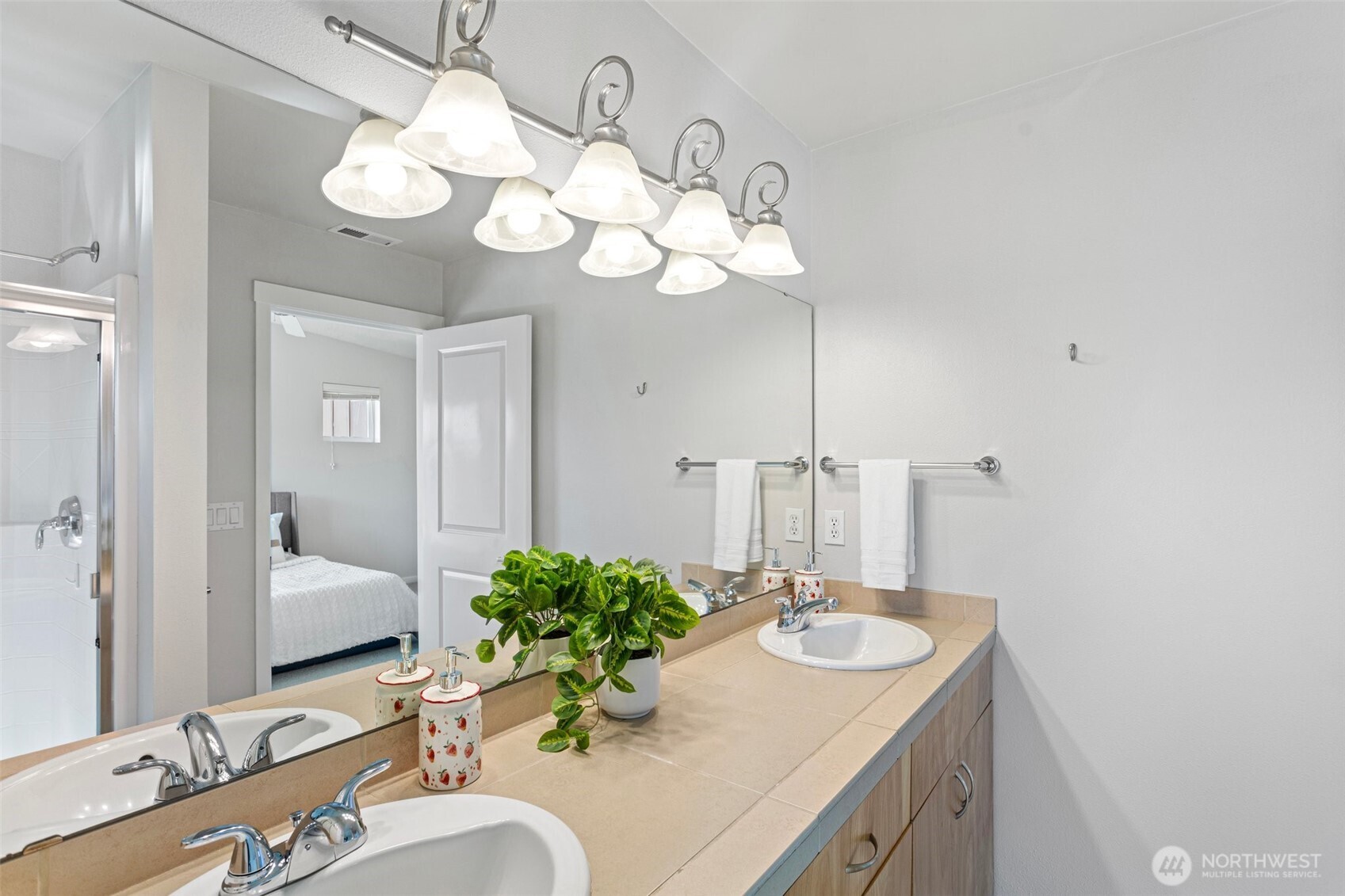 83 Sky Ridge Road Northwest Issaquah, WA 98027 - Photo 24 of 28 a bathroom with a sink vanity and a mirror