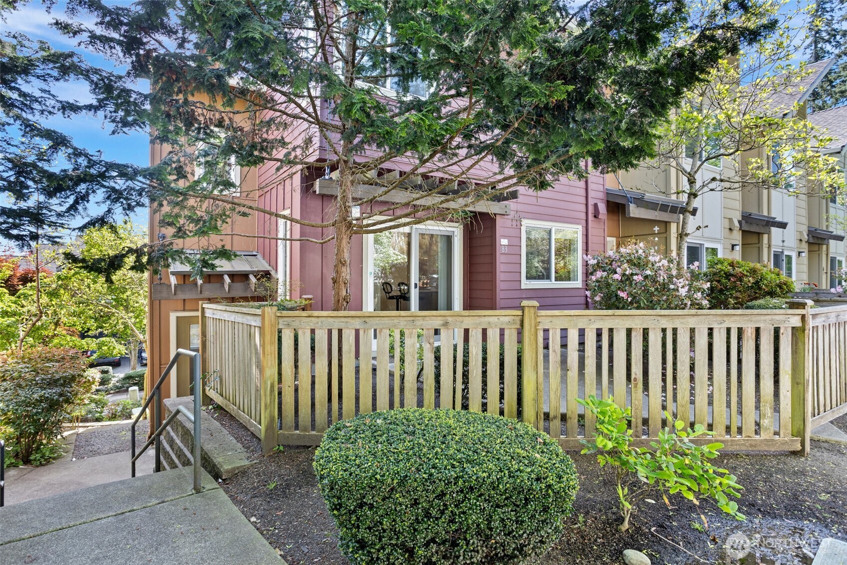 83 Sky Ridge Road Northwest Issaquah, WA 98027 - Photo 3 of 28 a view of a house with a small yard and plants